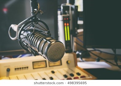 Microphone and mixer used for radio broadcasting (Stock photo)