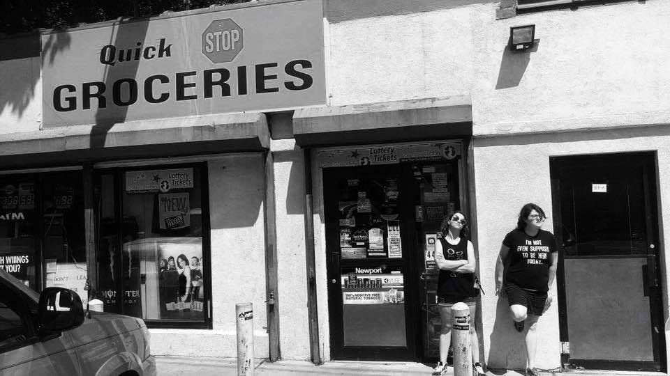 Daneille posing in front of a Quick Stop GROCERIES store in Leonardo, NJ